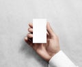 Hand holding blank vertical white business namecard mock up. Royalty Free Stock Photo