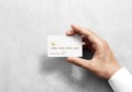 Hand holding blank white credit card mockup with chip Royalty Free Stock Photo