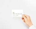 Hand holding blank white credit card mockup . Royalty Free Stock Photo