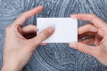 Mock up. woman holding white card usb flash memory card Royalty Free Stock Photo