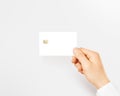 Hand holding blank white credit card mockup isolated. Royalty Free Stock Photo