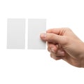 Hand holding a blank white rectangular card with another blank card beside it isolated on white background Royalty Free Stock Photo