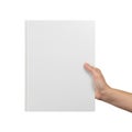 A hand holding a blank white rectangular object against a plain background Royalty Free Stock Photo