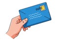 Hand holding a blue envelope with a postage stamp and wavy lines, ready for delivery Royalty Free Stock Photo