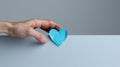 The hand holding blue heart.AI generated image Royalty Free Stock Photo