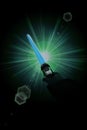 Hand holding blue light saber Royalty Free Stock Photo