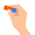 Hand holding a blue and red eraser Royalty Free Stock Photo