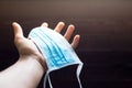 Hand with blue surgical mask Royalty Free Stock Photo