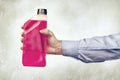 Hand Holding a Bottle of Antifreeze Royalty Free Stock Photo