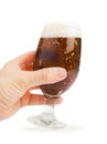 Hand holding bottle of beer and beer mug Royalty Free Stock Photo