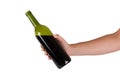 Hand holding a bottle of red wine Royalty Free Stock Photo