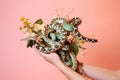 Hand holding a bouquet of snakes created with Generative AI technology