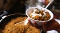 Hand holding bowl with Rice with curd