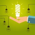 Hand holding a bright energy saving light bulb. Concept of inspiration, ideas. vector illustration. Royalty Free Stock Photo