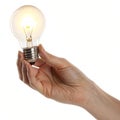 Hand holding a bright light bulb Royalty Free Stock Photo