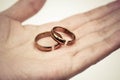 Hand holding broken rings Royalty Free Stock Photo