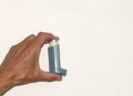 hand holding bronchial asthma spray inhaler Royalty Free Stock Photo