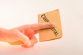 Hand holding a brown color paper with text confidental Royalty Free Stock Photo