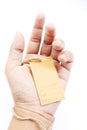 Hand holding brown empty paper tag Royalty Free Stock Photo