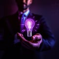 Hand holding bulb. Businessman holding a bright light bulb. Concept of Ideas. Royalty Free Stock Photo