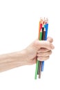 Hand holding bunch of colorful pencils Royalty Free Stock Photo