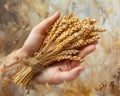 Hand holding a bundle of harvested wheat