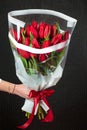 Buquet of red tulips on the dark background