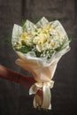 Buquet of white flowers on the dark background