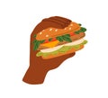 Hand holding burger. American fast food, hamburger with meat and vegetables stuffing between buns. Tasty fastfood snack