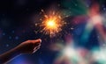 Hand holding a burning sparkler Royalty Free Stock Photo