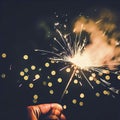 Hand holding burning Sparkler blast on a black bokeh background at night,holiday celebration event party,dark vintage tone Royalty Free Stock Photo