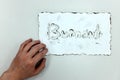 Hand holding a burnt white paper with burnout word. Work life balance, work stress and burnout concept Royalty Free Stock Photo