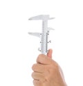 Hand holding caliper in front of white background