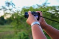 Hand holding camera photograph in nature background Royalty Free Stock Photo