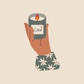 Hand holding candle. Cozy cartoon scented wax candle in glass, aromatherapy relax concept. Vector flat illustration