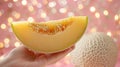 Hand holding cantaloupe slice with select cantaloupes on blurred background, copy space available Royalty Free Stock Photo