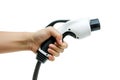 Hand holding a Car Electrical Charge Cable plug Royalty Free Stock Photo