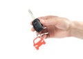 Hand holding the car key. Close up. Isolated on a white background Royalty Free Stock Photo