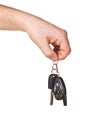 Hand holding car key and remote control Royalty Free Stock Photo