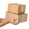 Hand holding cardboard boxes isolated on white background Royalty Free Stock Photo