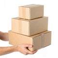 Hand holding cardboard boxes isolated on white background Royalty Free Stock Photo