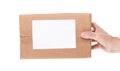 Hand holding cardboard mail box isolated on a White background