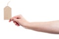 Hand holding cardboard tag
