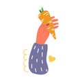 Hand holding carrot. Love vegetables concept.