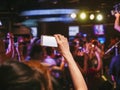 Hand holding Cell phone Blank screen Photo shot Blur Concert Royalty Free Stock Photo
