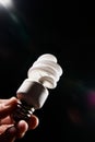 Hand holding cfl light-bulb lamp Royalty Free Stock Photo