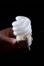 Hand holding cfl light-bulb lamp Royalty Free Stock Photo