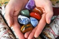 Hand Holding Chakra Crystals with White Sage Royalty Free Stock Photo