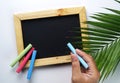 Hand Holding Chalk. Blank Wooden Frame Blackboard with Colorful Royalty Free Stock Photo