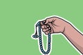 Hand Holding Chaplet of Beads Sticker vector illustration. Islamic holiday icon concept.